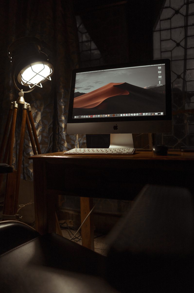 A calm, warmly lit workspace seen through a portal